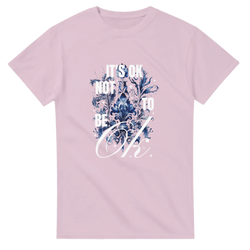 Pink cotton-blend tee featuring blue floral graphic and It's OK Not To Be OK slogan.