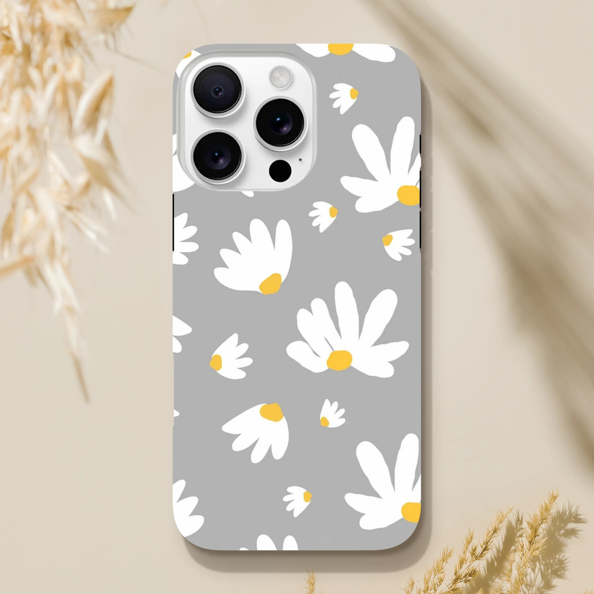 Grey tough iPhone case featuring white daisies with yellow centers on a utilitarian grey background foriPhone 13-16.