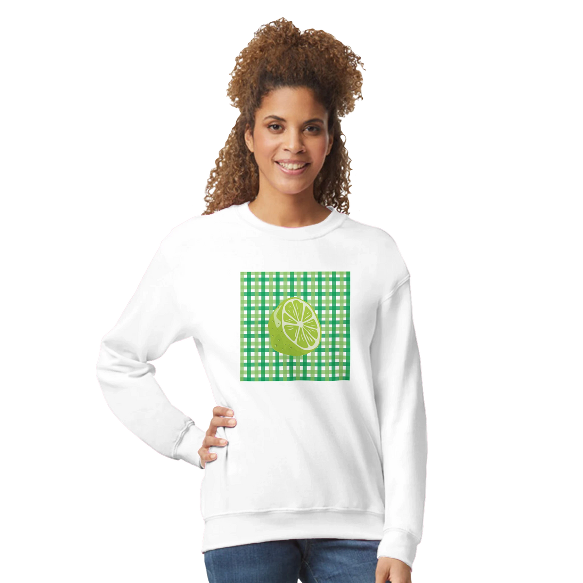 Woman wearing a white sweatshirt featuring a lime graphic on a green gingham panel.