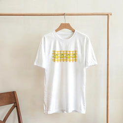White women's Lemon Gingham T-Shirt on a hanger featuring a lemon print inside a yellow gingham block.