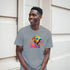 Smiling man wearing a gray Cool Dog T Shirt with a soft cotton blend, neon dog graphic and sunglasses.