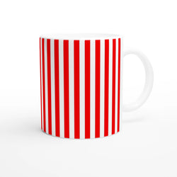 Red striped ceramic mug with candy cane pattern and white handle, retro coffee cup.