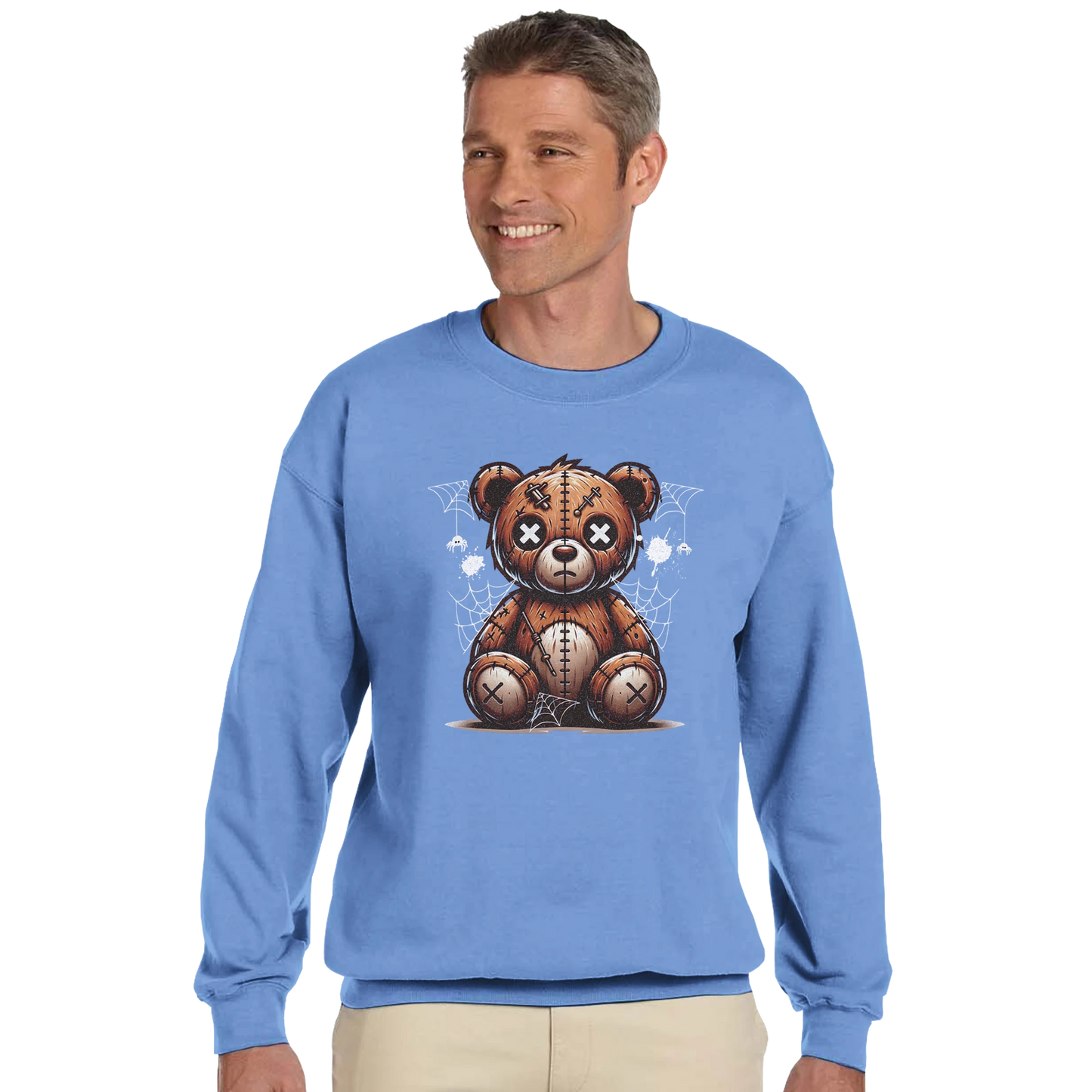 Man wearing a blue men's graphic sweatshirt with a teddy bear graphic on a white background.