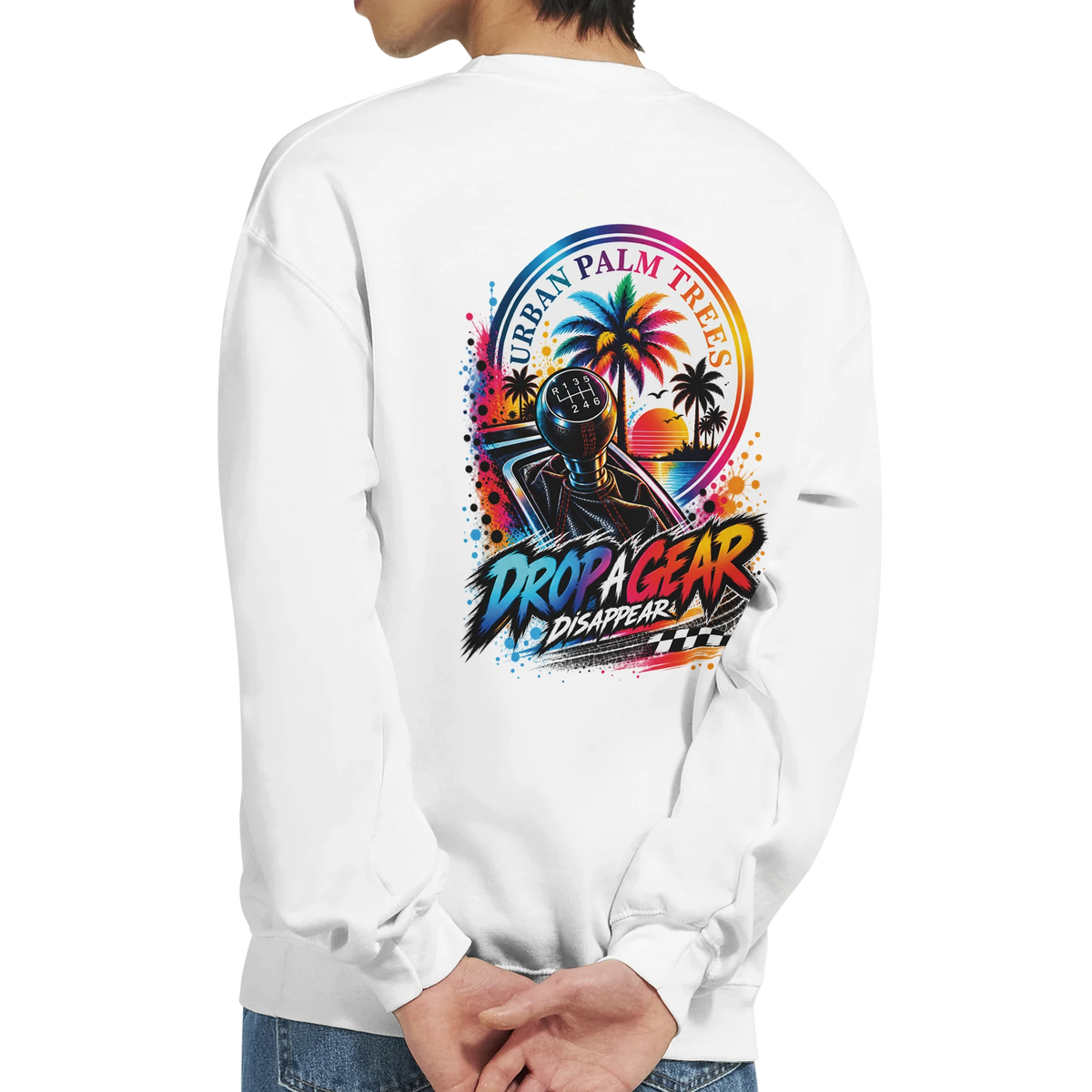 White sweatshirt back featuring colorful "Drop A Gear" graphic with manual shifter, palm trees, and retro sunset design.