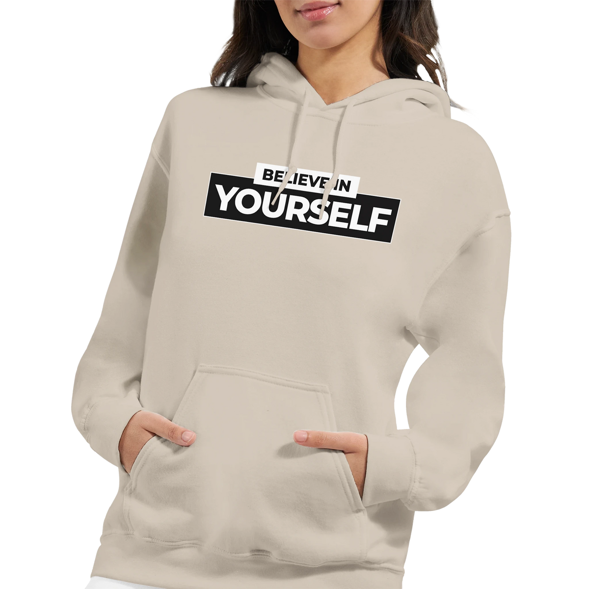 Beige Believe In Yourself hoodie with bold black slogan, worn by a woman.
