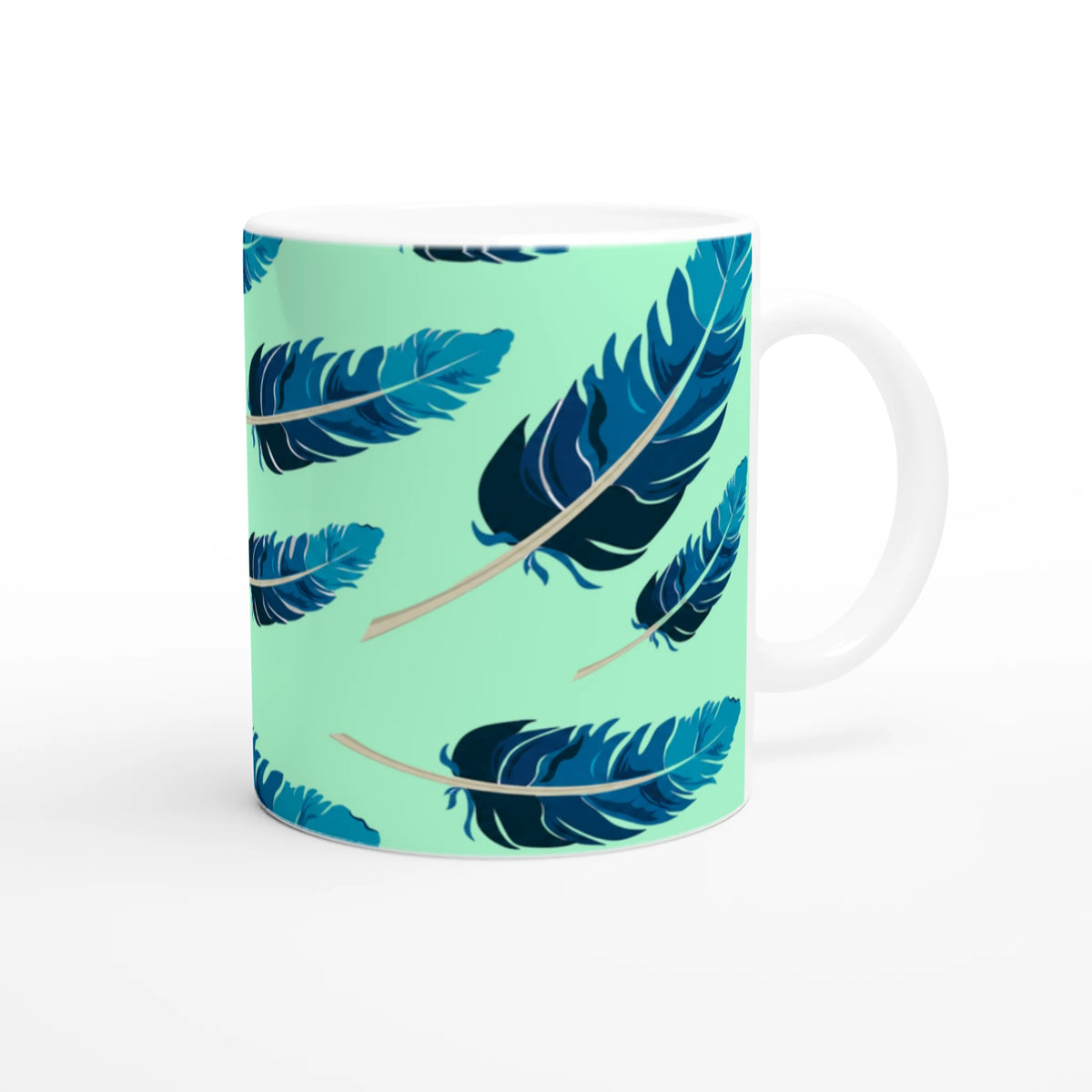 Blue feather mug with mint-green gradient and white handle, perfect for coffee or tea.
