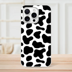 Black & White Cow Print iPhone Case for iPhone 13–16 with bold Y2K animal pattern.