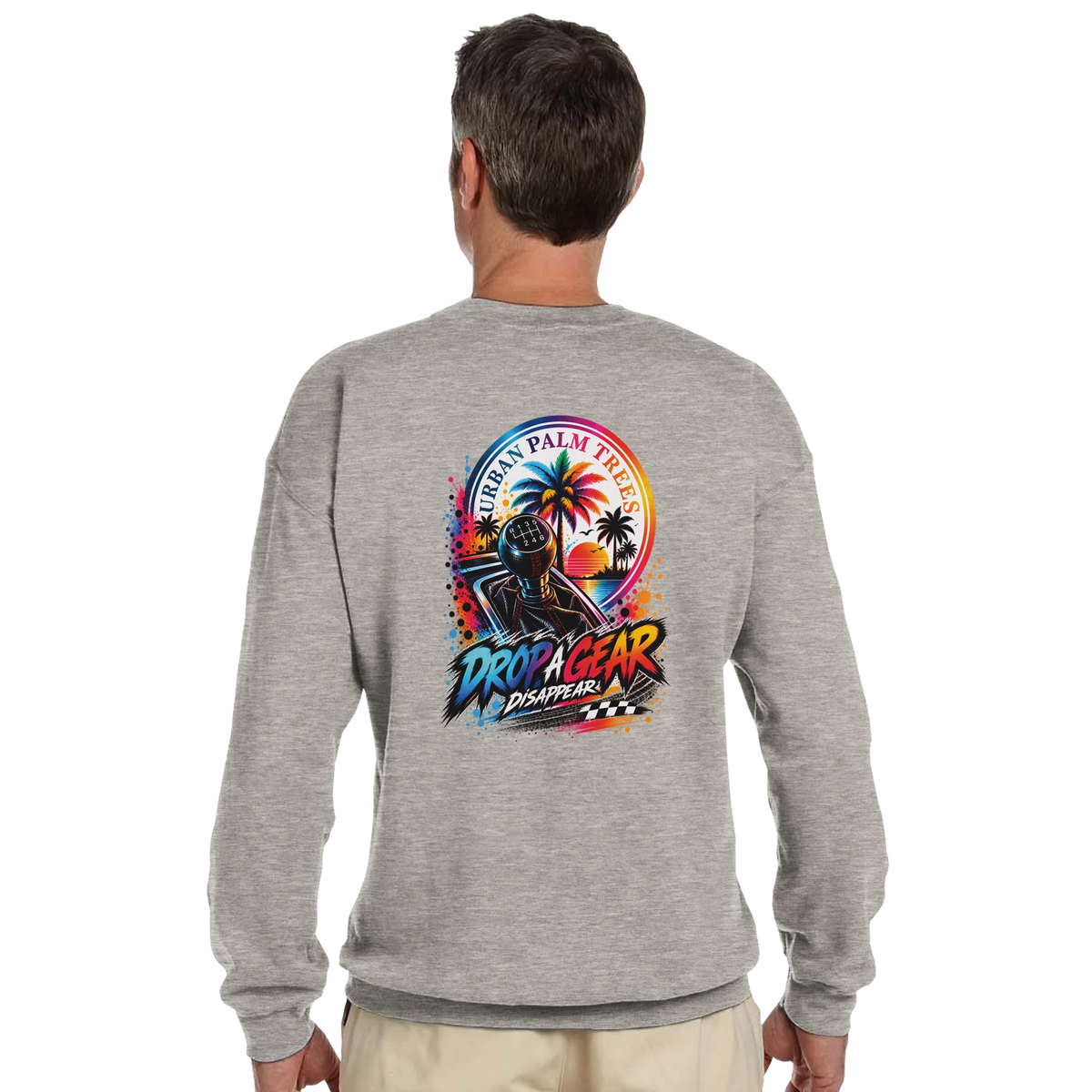 Grey petrolhead sweatshirt featuring colorful gear shift, palm trees, and "Drop A Gear Disappear" back print.