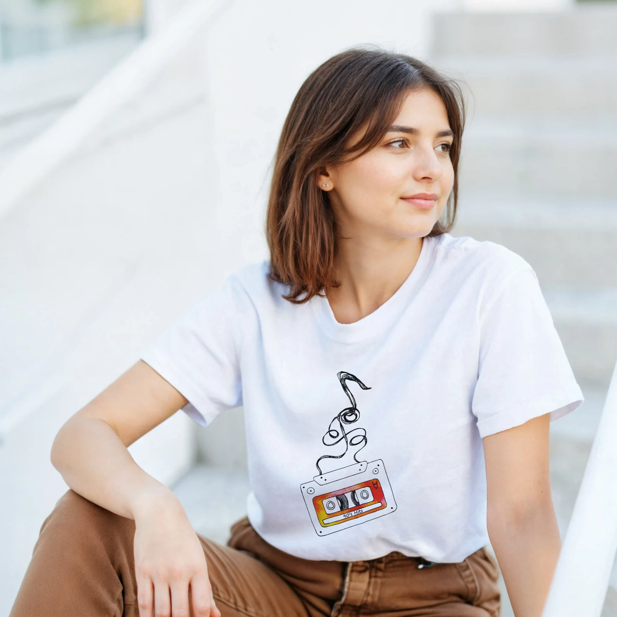 Retro cassette tape t-shirt for women featuring vintage 90s hits audio artwork and streaming tape design for streetwear style.