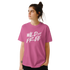 Woman wearing pink Cute Wild And Free T‑Shirt with bold white retro slogan.