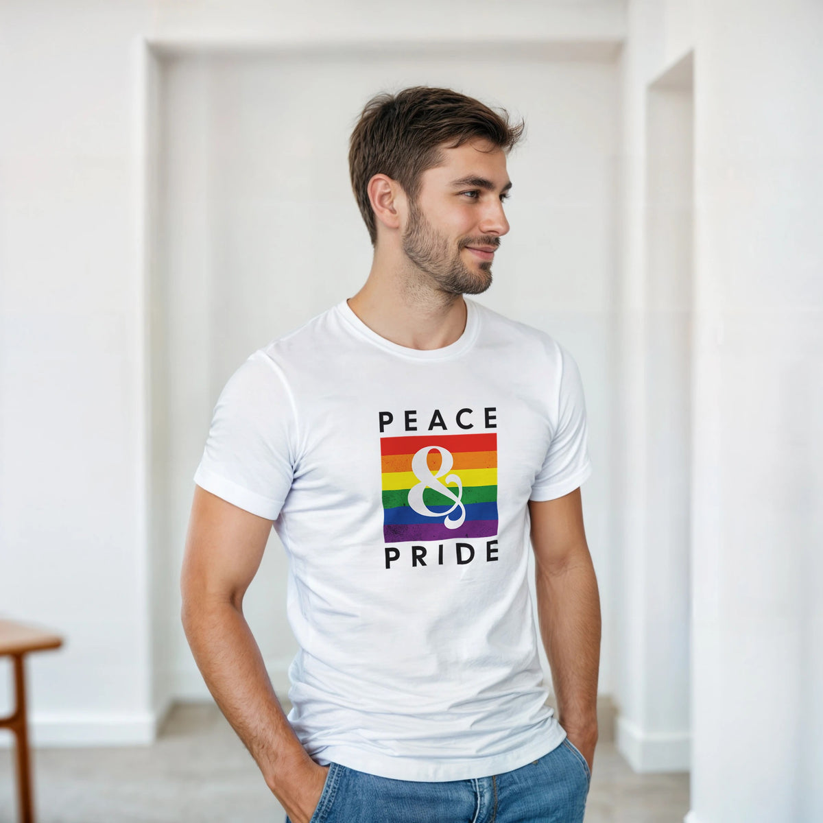 Male model wearing white Pride LGBTQ graphic tee with rainbow square on soft cotton blend fabric.