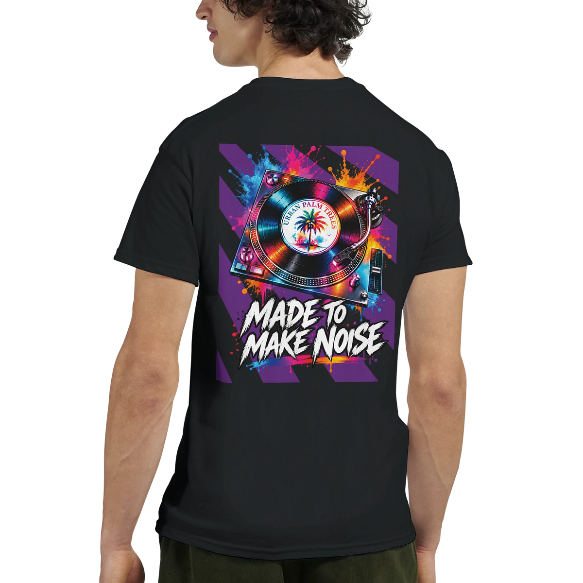 Black t-shirt back print featuring colorful retro turntable graphic, palm tree vinyl, and text "Made To Make Noise" with paint splatters.