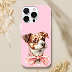 Pink tough iPhone case featuring a cute puppy wearing a floral bow. Shock-absorbent phone cover for iPhone 13-16.