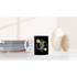 White ceramic mug with Good Vibes Only floral wreath on black, on a shelf beside books and vases.