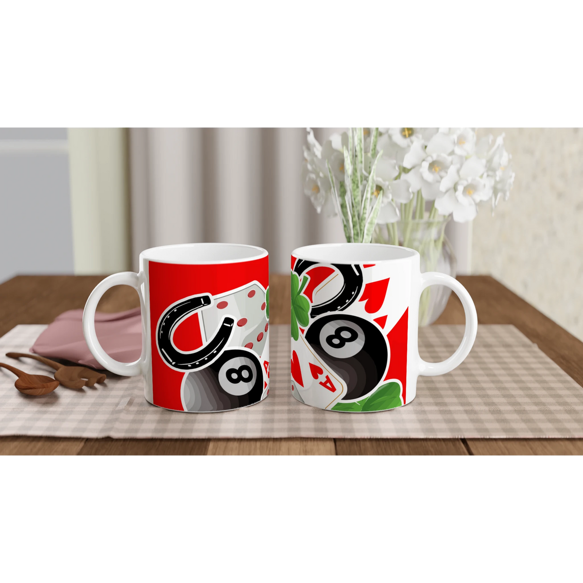 Two Lucky Casino ceramic mugs with dice, playing cards and 8-ball designs on a table with a checkered placemat.