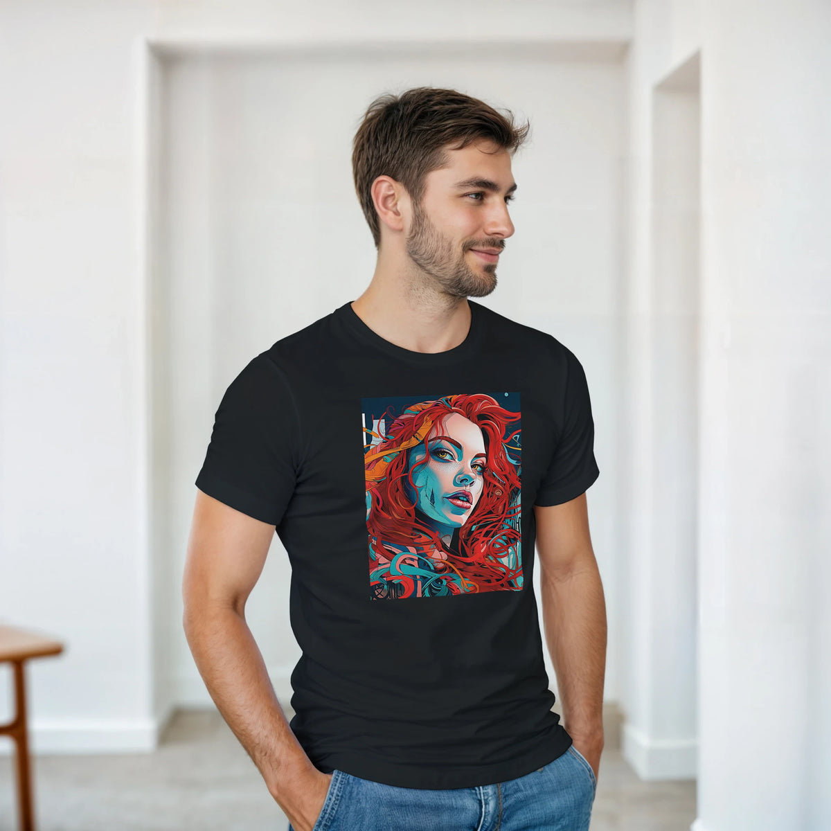 Man wearing black streetwear tee with bold artistic graphic of a stylish redhead woman featuring vibrant red and blue portrait art.