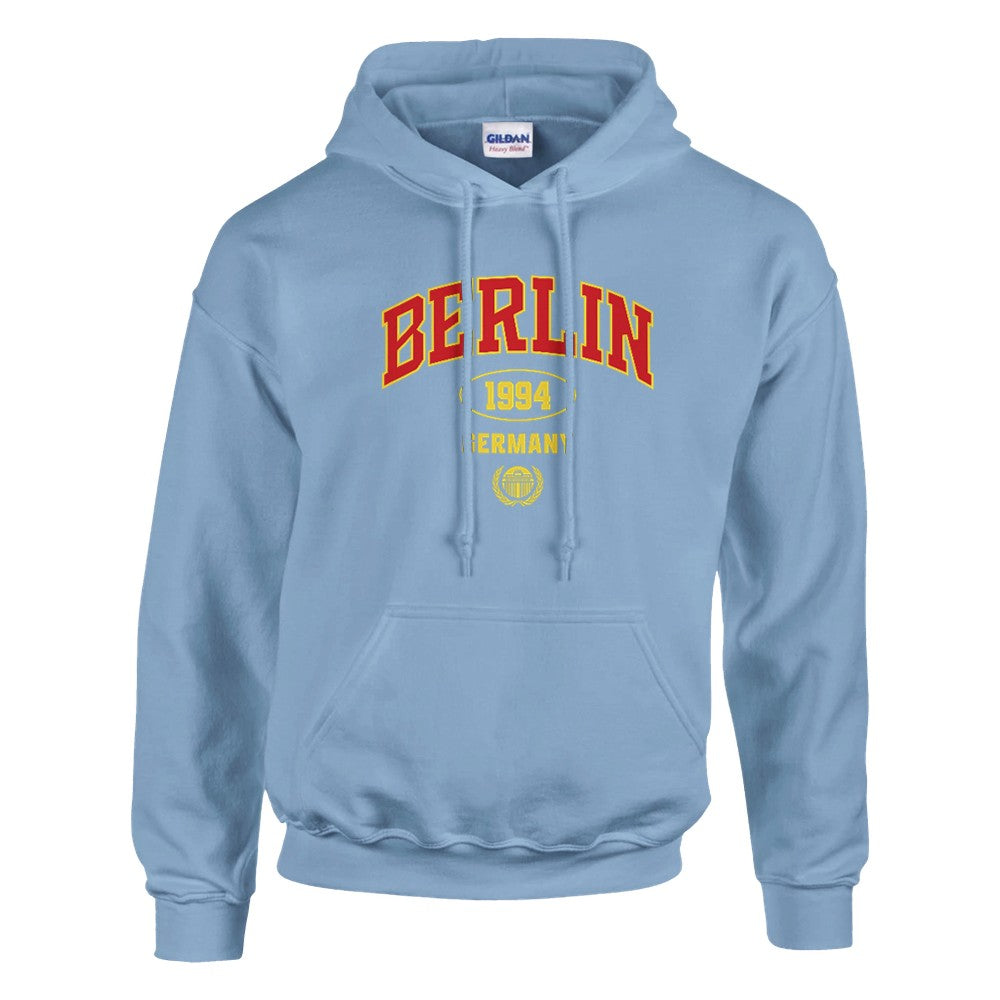 Blue Berlin graphic women's hoodie with red and yellow lettering, soft cotton blend and front pocket.
