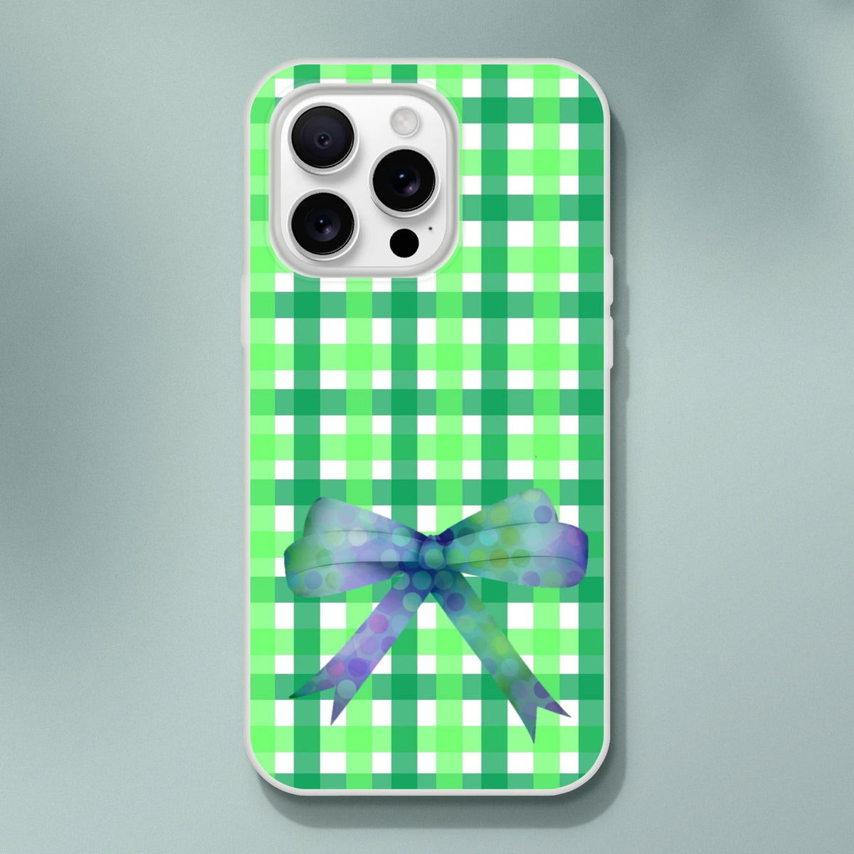 Green gingham bow iPhone case for iPhone 13-16 with frosty transparent TPU and printed bow.