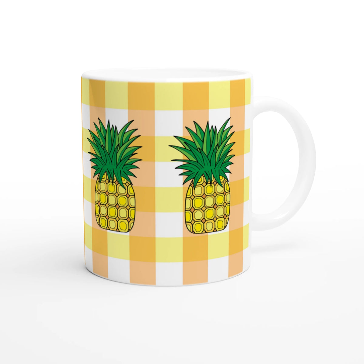 Cute pineapple gingham mug with yellow checks and pineapple illustrations.