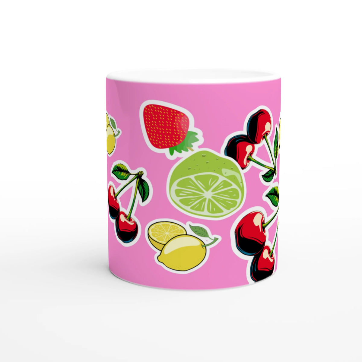 Cute Fruit Ceramic Mug with cherries, lemons, and lime on a pink background.