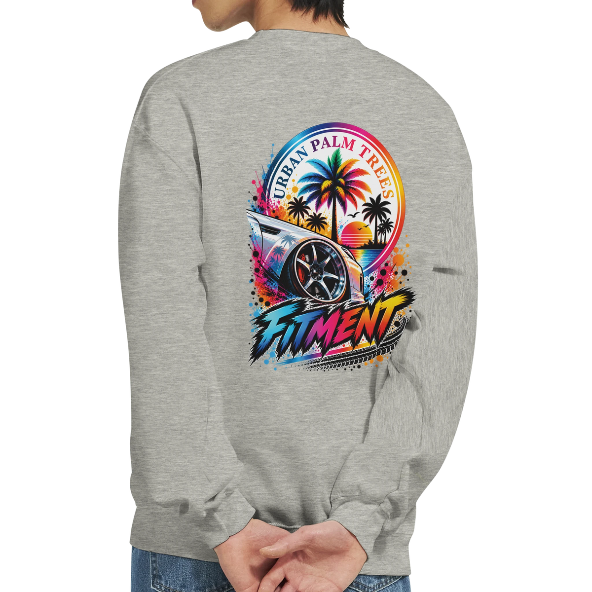 Gray crewneck sweatshirt back print featuring lowered modified car, "Urban Palm Trees" graphic, and bold "FITMENT" text in vibrant retro colors.