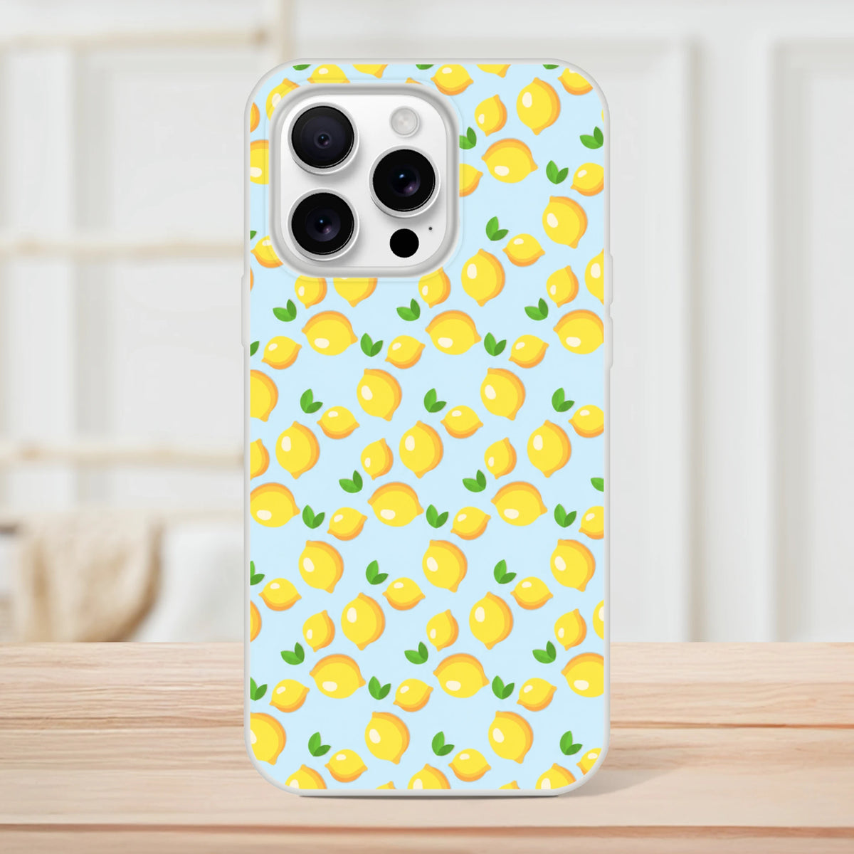 Blue mini lemon-pattern iPhone case (13-16) with slim matte finish and citrus flair.