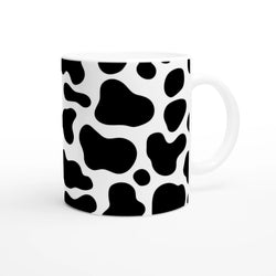 Black and white cow-print ceramic mug, a cute Y2K animal print coffee cup.