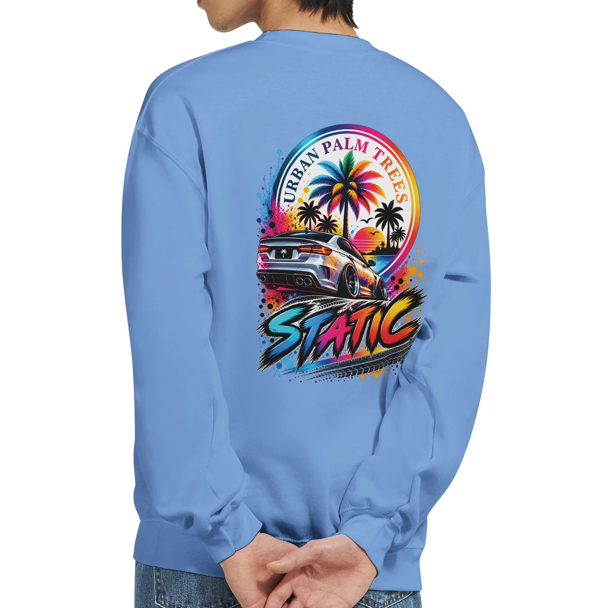 Back of light blue sweatshirt featuring vibrant static petrolhead graphic with lowered car, palm trees, and Urban Palm Trees text.