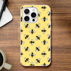 Yellow iPhone 13-16 case featuring a playful honey bee motif on a yellow background.