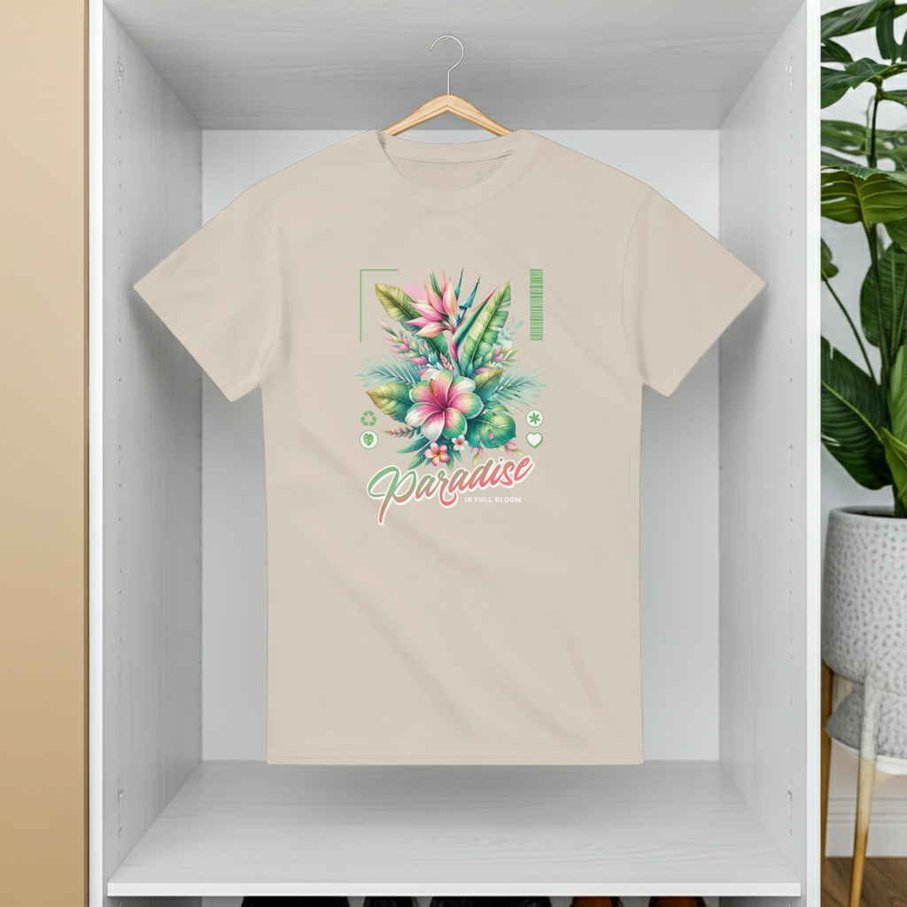 Beige t-shirt with floral design and 'Paradise' text on a hanger against a white wall.