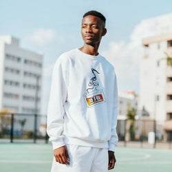 White men's sweatshirt featuring a retro cassette tape graphic with unwinding tape. Vintage music streetwear jumper.