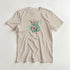 Beige Paradise women's graphic tee with tropical floral print in pinks and greens on a soft cotton blend.