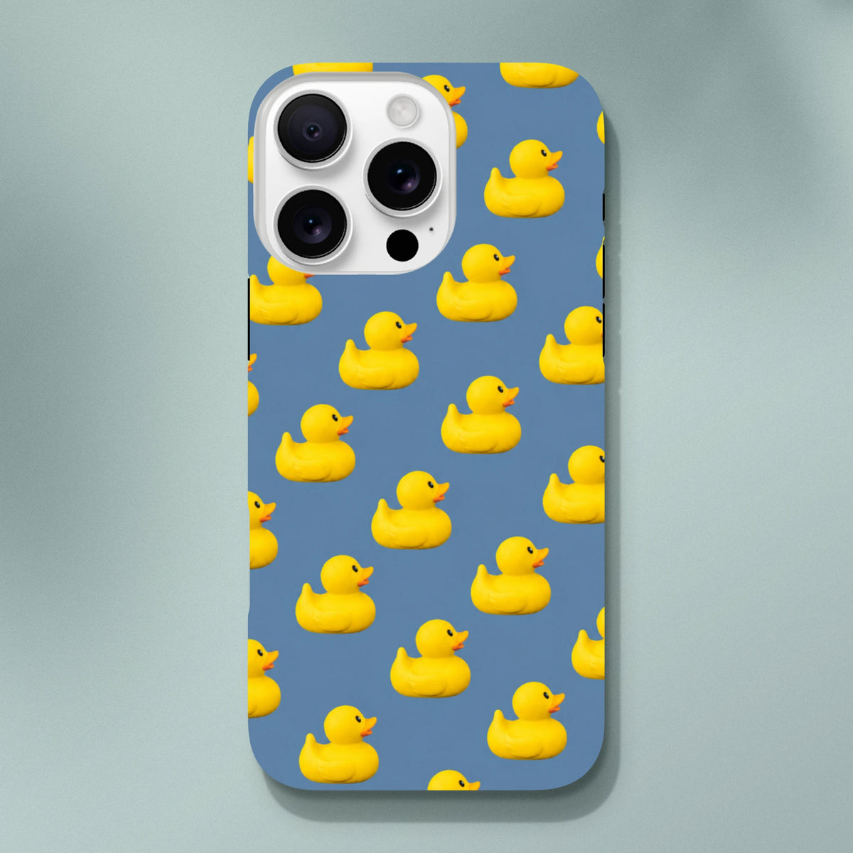 Blue kawaii phone case featuring a pattern of cute yellow rubber ducks for iPhone 13-16 tough protection.