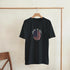 Black Made in USA men's graphic T-shirt with circular American flag graphic on front.