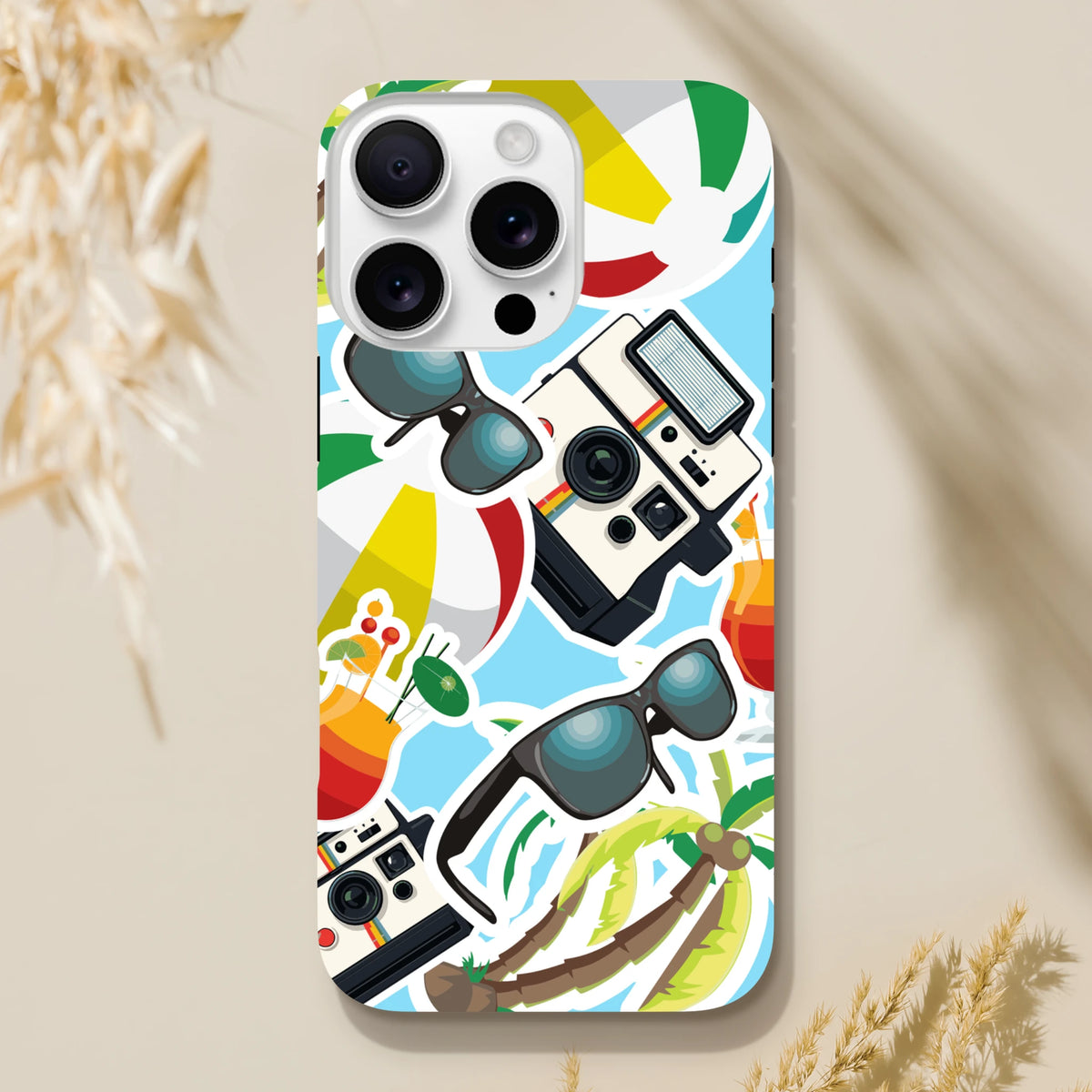 Blue summer holiday iPhone case featuring sticker-style palm trees, vintage cameras, sunglasses, and cocktails on a light blue background.