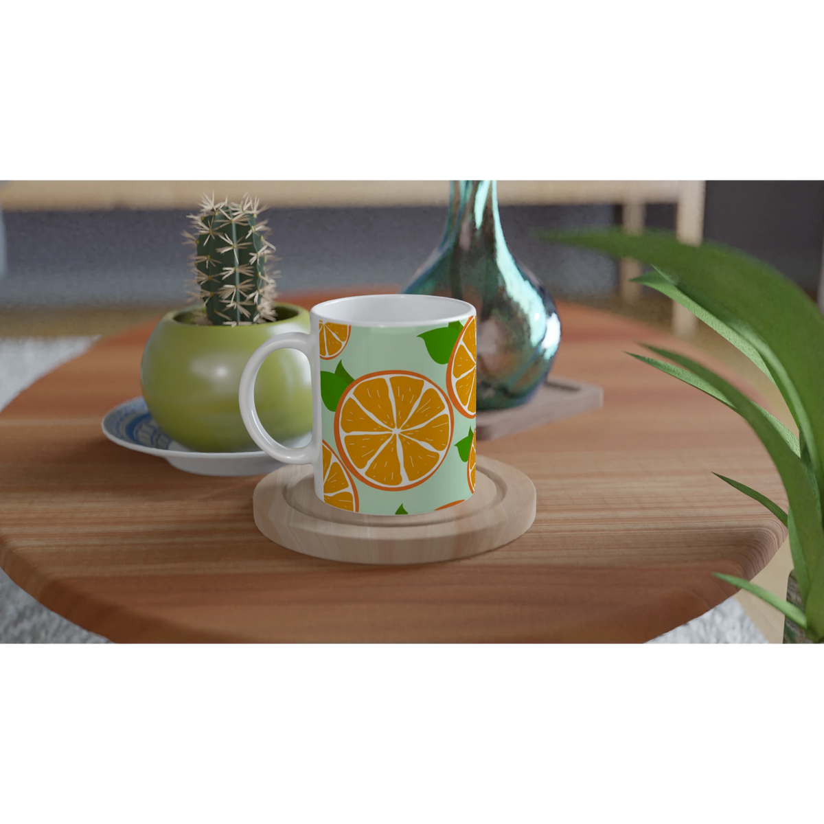 Cute orange mug with citrus slice design on mint-green background, set on a wooden table beside a cactus.