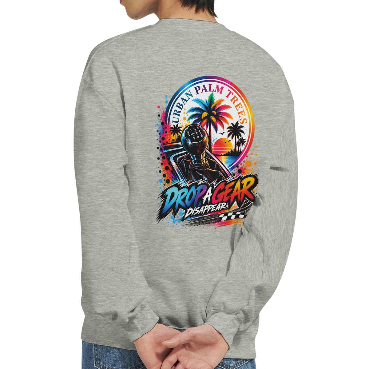 Grey sweatshirt featuring a colorful Drop A Gear graphic with a manual shifter, retro palm trees, and sunset background.