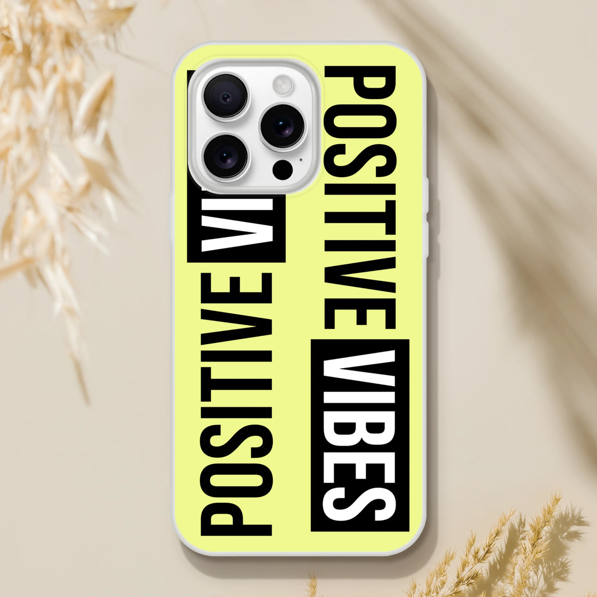 Bright yellow iPhone 13-16 case with bold black POSITIVE VIBES slogan and slim matte finish.