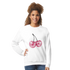 Smiling woman wearing a white pastel Y2K cherries glitter sweatshirt from Urban Palm Trees.