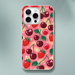 Retro pink iPhone case featuring a pattern of red cherries, strawberries, and sparkles. Shock-absorbing TPU cover for iPhone 13-16.