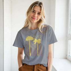 Woman wearing gray Cute Summer T-Shirt with yellow palm-tree sun graphic, retro vintage vibes.