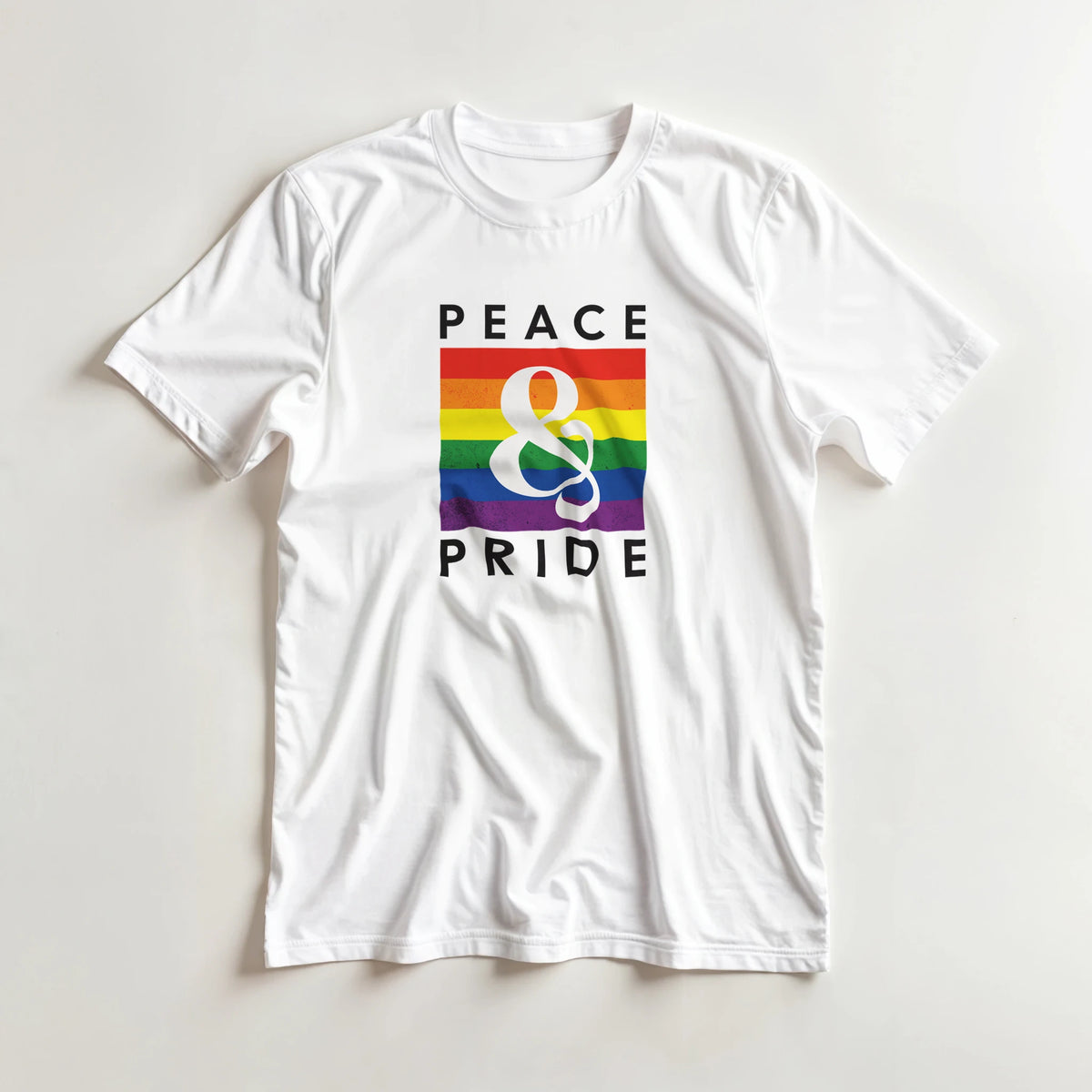 White T-shirt featuring a retro rainbow graphic with "PEACE & PRIDE" text and a large ampersand symbol.