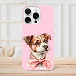 Pink iPhone case featuring a cute brown and white puppy wearing a floral pink bow tie on a shock-absorbent shell.