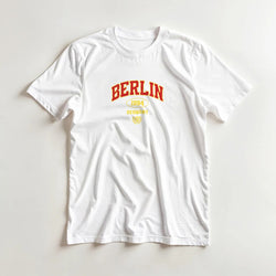 White women's Berlin cotton blend graphic T-shirt with red BERLIN and yellow 1994 Germany design, short sleeves.