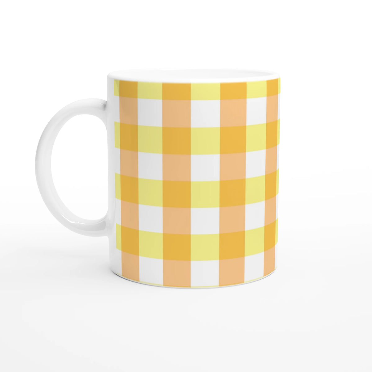 Yellow gingham ceramic mug with orange-yellow checks and white handle.