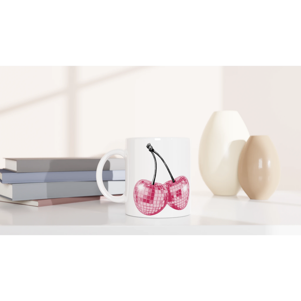 Cute Glitter Cherries retro coffee cup with pink glitter cherries on white ceramic on a desk.