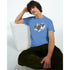 Male model wearing blue Hype graphic T-shirt with bold black Hype logo over white brushstroke design.