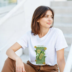 Woman wearing a white Retro Zesty Lemon graphic tee featuring a green citrus can design for modern streetwear.