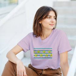 Woman in lavender T-shirt with pastel stripe panel and gold star graphic.