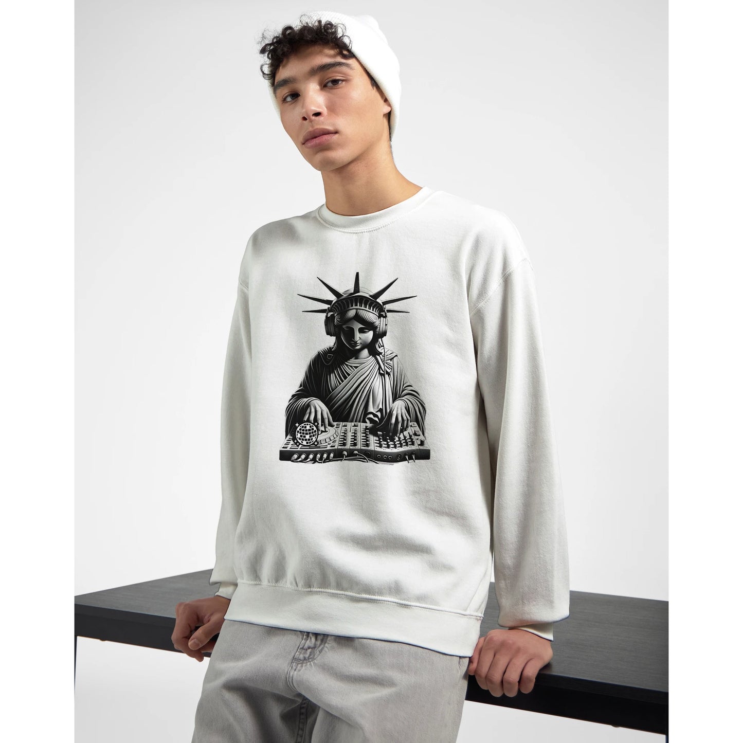 Person wearing a white men's graphic sweatshirt with a graphic design of the Statue of Liberty on a white background